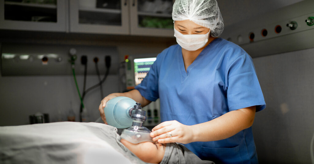 Anesthesiologist administering anesthesia