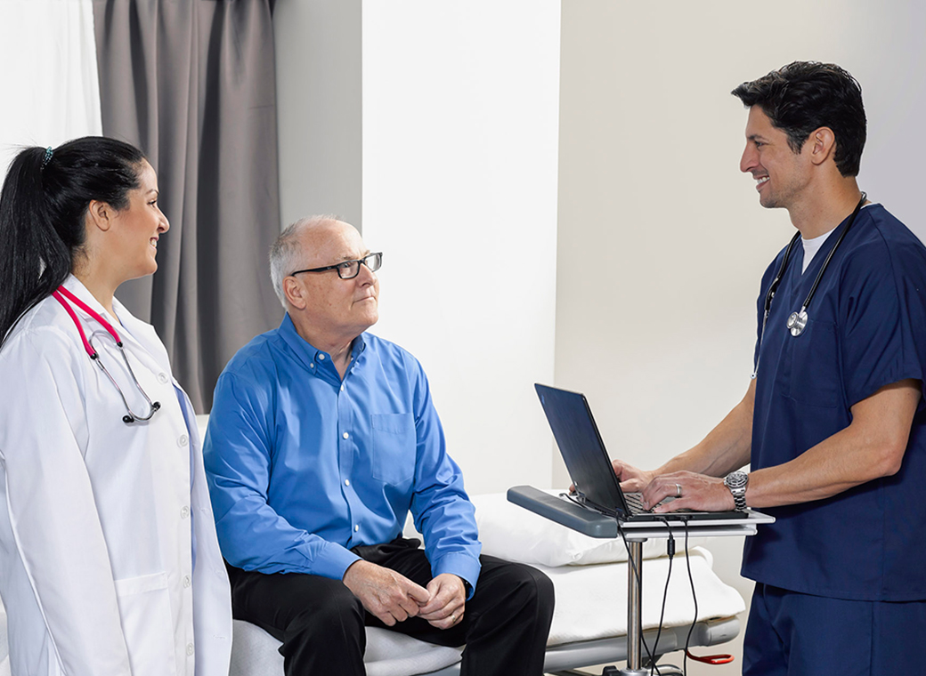 Physicians talking to a patient